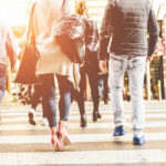 Group of pedestrians crossing a street in an urban setting