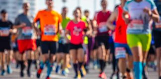 A group of runners participating in a marathon on a sunny day
