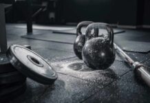 Harvard Study Upends Gym Dogma Kettlebells and weights on a gym floor with chalk dust