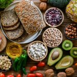 Diabetes Trigger Hiding in ‘Healthy’ Fat? A variety of fresh foods including vegetables, fruits, grains, and proteins arranged on a wooden surface