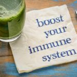 Scientists Mute Inflammation Trigger With Diet Green smoothie beside napkin with motivational message