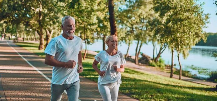 1783890110801-7spbww-shutterstock-1191418468 Older couple jogging on a lakeside path