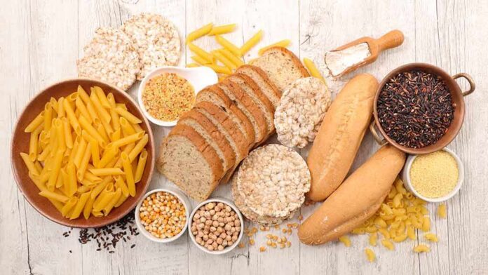shutterstock_1020163204 Assorted grains and breads on a wooden table