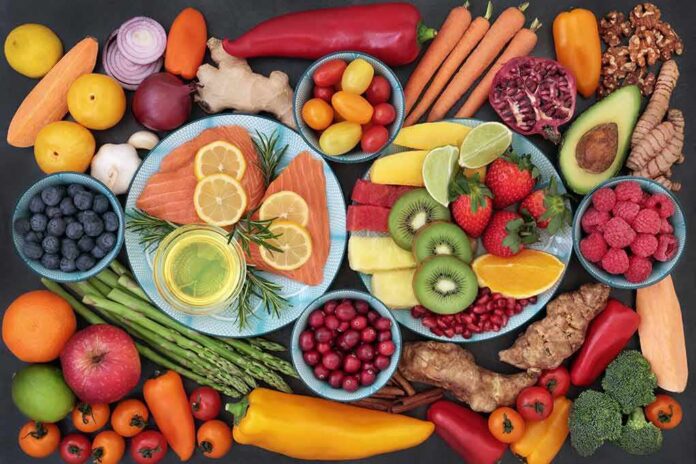 shutterstock_1042237912 Assorted fruits, vegetables, and salmon slices on plates