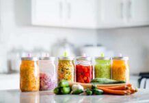 Kitchen Hack That SLASHES Hormone Disruptors Assorted pickled vegetables in jars on a kitchen counter