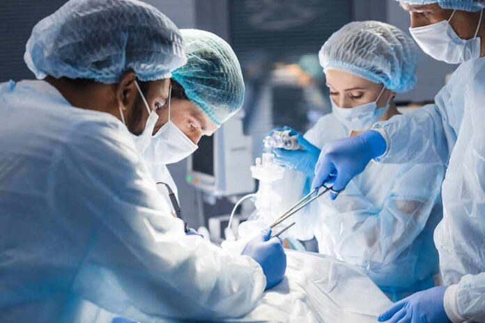 shutterstock_1265400856-1 surgeons performing an operation
