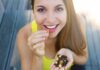 Doctor-Backed Nut Ups Life Expectancy Woman eating mixed nuts and seeds
