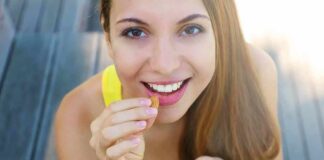 Woman eating mixed nuts and seeds
