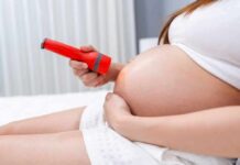 Immune Cells That Jump-Start Labor Contractions Pregnant woman shining flashlight on bare belly