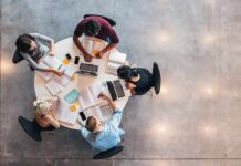 Group of students collaborating at a round table