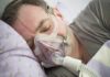 Man sleeping with a CPAP mask on his face