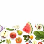 The one fruit that keeps the diabetes doctor away Assorted fresh fruits and vegetables arranged along the bottom on white