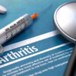 Collagen Surprise Shakes Arthritis Playbook Syringe and stethoscope on arthritis document