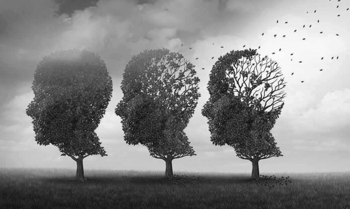 shutterstock_1085332631-1 Three trees shaped like human heads losing leaves