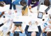 Group of professionals collaborating around a conference table