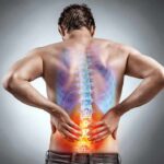 Back Pain Plot Twist: Food vs Pills Man holding lower back with highlighted spine illustration