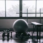 Over-50 Muscle Gains Without Daily Lifting home gym with weights and exercise ball